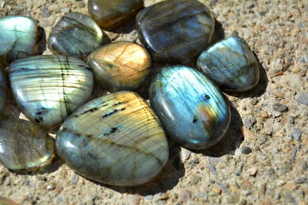 an array of polished Labradorite stones in the sun