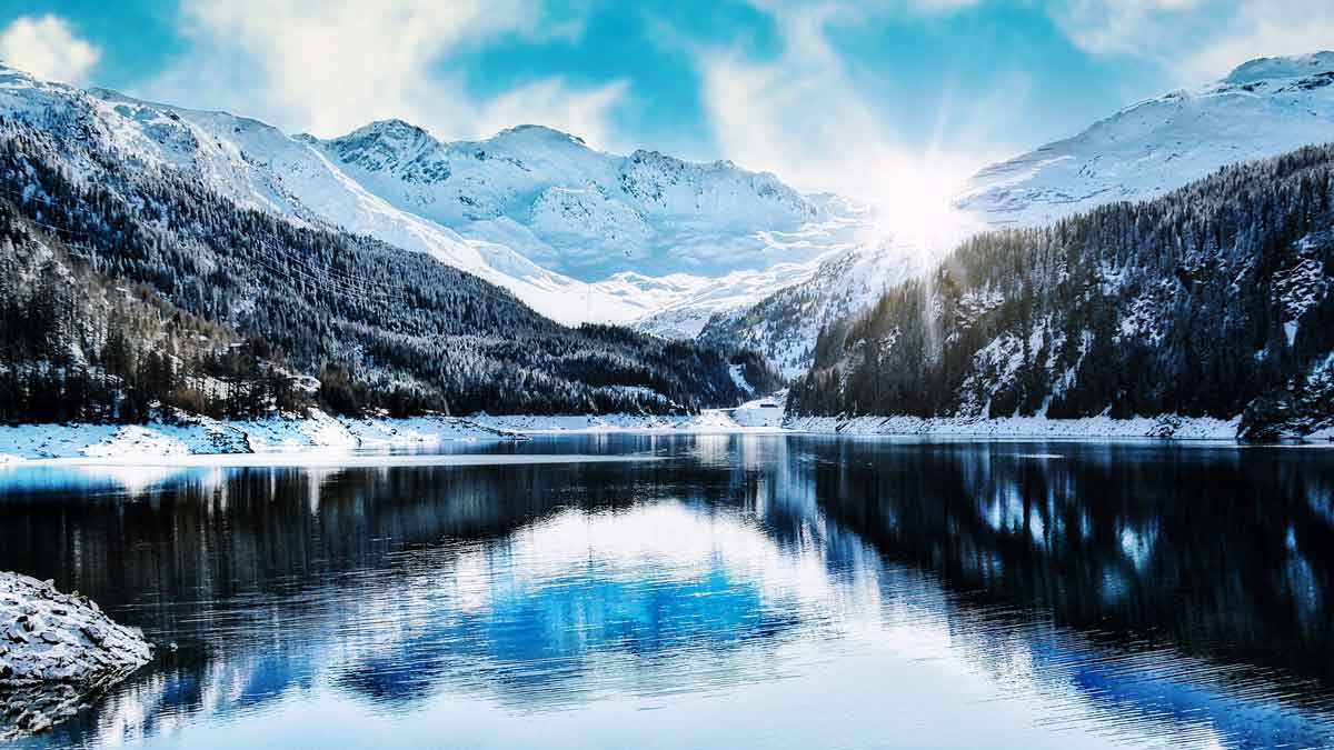 Jerry Mikutis - Reiki Chicago - View of snow covered mountains and a frozen lake