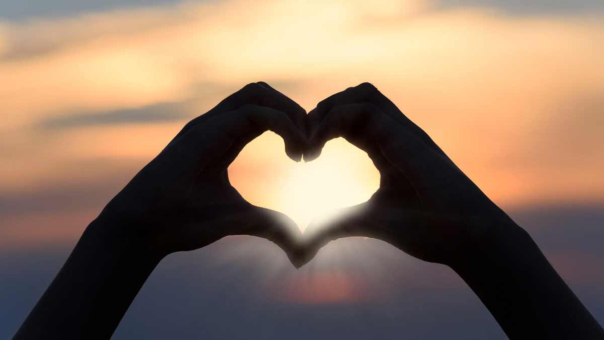 Jerry Mikutis - Reiki Circle Chicago - Valentine's Day - Hands making heart symbol at sunset